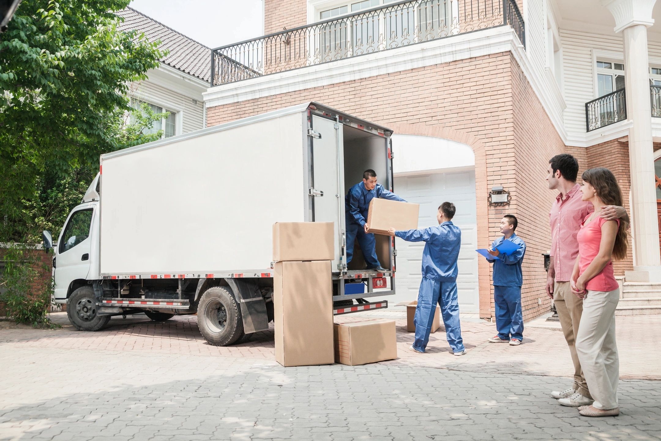 Movers loading a truck for a long-distance move