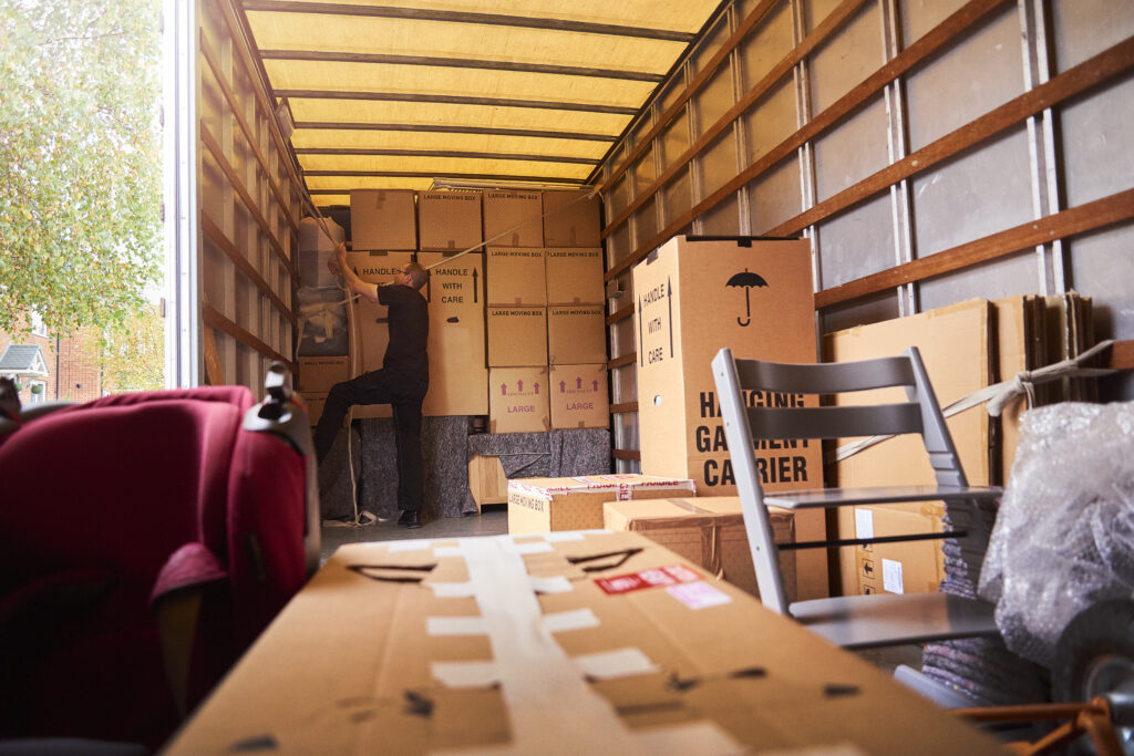 A moving truck laden with belongings